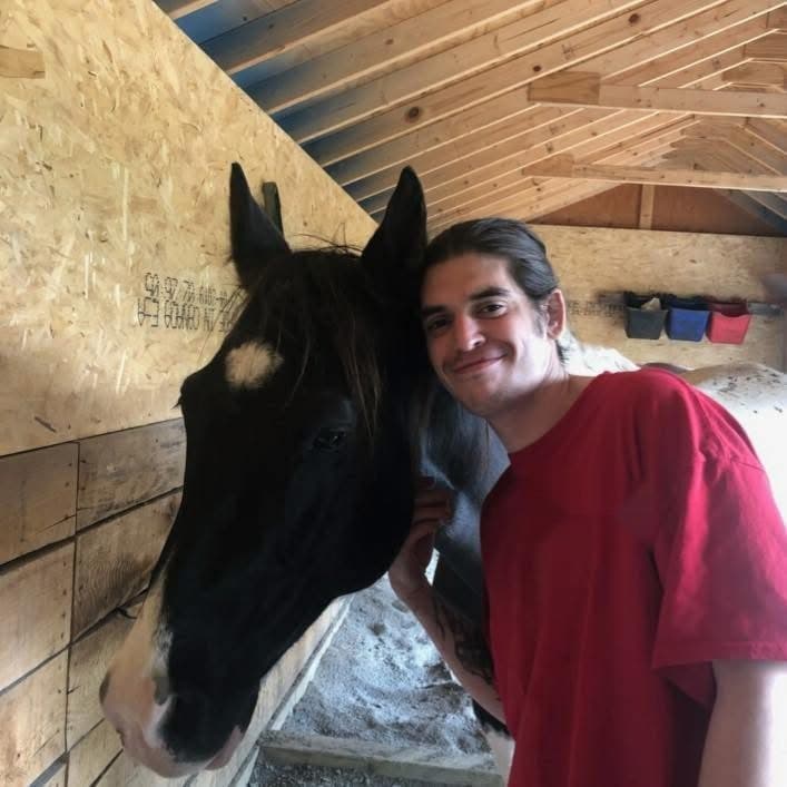 Alexander Ritter with one of the horses at his family's Rolling Ridge Farm
